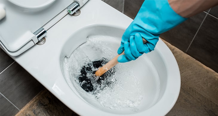unblocking toilet