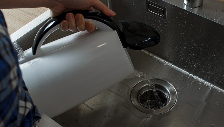 pouring boiling water down drain